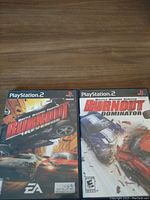 Photo of Burnout Revenge and Burnout Dominator PS2 game cases side by side