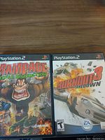 Front cover of Rampage Total Destruction and Burnout 3 Takedown PS2 game cases.