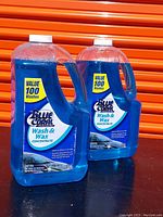 Two bottles of Blue Coral Wash & Wax Concentrate with labels facing forward showing product details and usage capacity.