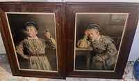 Two framed portraits by Pears, shown side by side, wooden frames with glass fronts.