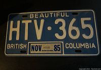 Front view of 1985 British Columbia license plate with registration HTV-365 and NOV 85 sticker showing clear lettering and colors.