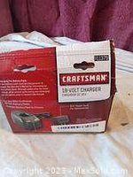 Photo of the Craftsman charger box showing branding, model number, and condition information.