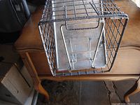 Top view showing the metal trigger plate inside the cage and wire mesh construction.