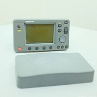Front view of Raymarine RN300 GPS navigator displaying screen and control buttons with a separate rectangular accessory box in front.