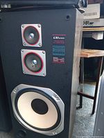 Close-up of one Sears LXI Series speaker showing three drivers and series label.
