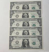 Five sequential 1995 US one-dollar bills, all front-facing showing crisp condition and sequential serial numbers F20275121* - F20275125*.