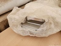 Wrapped chrome finish Lazy Susan circular base with visible reflective surface