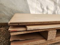 Close-up showing layered edges of plywood sheets revealing thickness and material construction.
