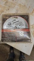 Photo of sealed 10-inch Sears Craftsman saw blade in original packaging showing product label and specifications.