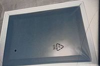 Back side shows clean factory protective plastic