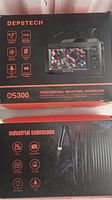 Box showing the DEPSTECH DS300 professional industrial endoscope with key features listed including 4.3 inch FHD screen, HD 720P video, IP67 waterproof, LED lights, TF card support, and rechargeable battery.