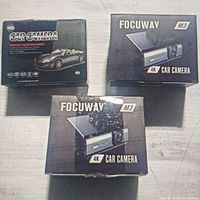 Three car camera boxes on white surface - two Focway M3 4K and one generic HD Car Camera