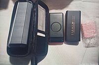 Four power banks shown with one power bank in carrying case, wireless charging pad, and power banks with visible capacity labels.