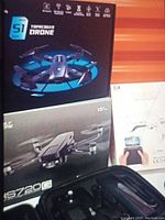 Boxed drones: Topcooks S1, Holy Stone HS720G, DM007
