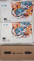 Two Huion Inspiroy H420X tablet boxes stacked and one Huion pen box below them.