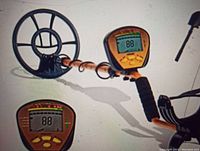 Assembled metal detector showing control unit, LCD reading 88, coil and shaft