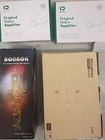 Two boxed Shidu Original Voice Amplifiers and two boxed wireless microphone sets (one Bonak and one unbranded)