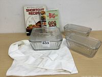 Full set showing baking dishes, cookbooks, and apron