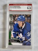 Front view of the 2016 Parkhurst Auston Matthews rookie card in grading slab.