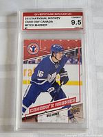 Front view of the graded hockey card showing Mitch Marner in Toronto Maple Leafs uniform with Overtime Grading label 9.5 GEM MINT.