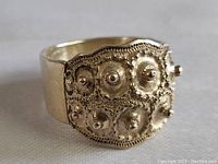 Close-up of early Gothic sterling silver hob nail ring showing detailed hob nail pattern and beaded edges.