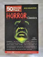 Front cover of the DVD box set showing the title '50 Movie Pack Horror Classics' with a horror face in green light.