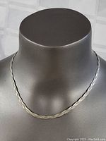 Full view of the sterling silver necklace displayed on a gray bust.