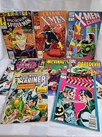 View of the 8 Marvel comic books arranged showing front covers.