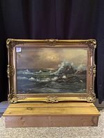 Front view of the painting showing the overall seascape and ornate frame.