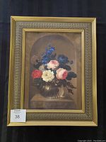 Full view of the original painting showing floral arrangement in an ornate gold frame.