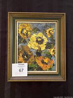 Full view of framed sunflower oil painting showing vibrant textured flowers and multi-layered frame.