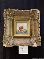 Full view of original framed painting showing the artwork and ornate frame with some damage.
