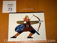 Front view of Viking ceramic plaque showing a red-bearded archer with bow, arrow, shield, and horned helmet