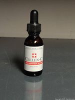 Front view of amber glass bottle with Cellex-C label and dropper cap.