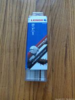 Front view of the plastic case showing Lenox branding, count (25 PC), blade size (6"), and teeth per inch (6 TPI).