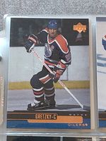 Front of Wayne Gretzky Upper Deck hockey card showing player in Edmonton Oilers uniform skating on ice.