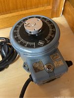 Top view showing the adjustable dial with voltage scale and central knob.