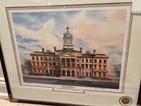 Full view of framed print illustrating Victoria Hall in Cobourg, Ontario, Canada with a sky backdrop.