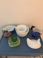 Full lot showing all items including mixing bowls, Depression glass, pitcher and chicken dish