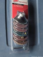 Packaged set of seven 2 inch sanding discs with metal arbor adapter from Ingersoll Rand, front view showing stacked discs and packaging details.