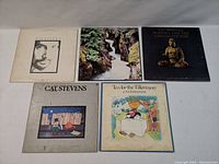 Front view of five Cat Stevens vinyl LP albums showing various cover artworks including 'Foreigner', 'Tea for the Tillerman', and 'Buddha and the Chocolate Box'.
