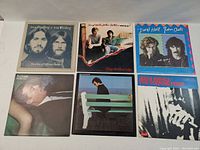 Photo of front album covers for the six vinyl records, showing the artists and album art