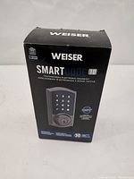 Front of box showing Weiser SmartCode 10 touchscreen electronic deadbolt