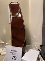 Photo showing a brown necklace display stand with one gold electroplated necklace placed on it to showcase the chain style and length.