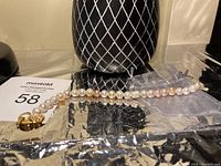 Pearl bracelet laid flat showing length and clasp