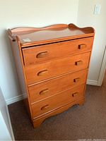 Full view of the Vilas highboy dresser showing overall shape, pine wood, and drawer handles