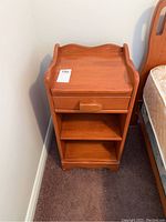 Front view of maple nightstand showing drawer, shelves and overall condition