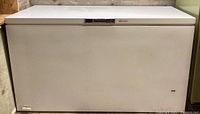Closed view of the white Sears Kenmore chest freezer showing exterior condition.