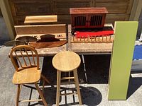 Wide view showing all items including stools, shelves, and green IKEA shelf with doors