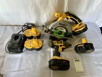 Full lot: charger, batteries, drill, circular saw